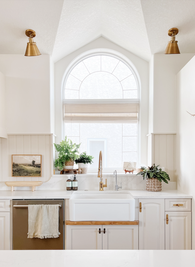 a modern farmhouse kitchen painted with simply white by Benjamin Moore and trim painted natural tan by Sherwin Williams